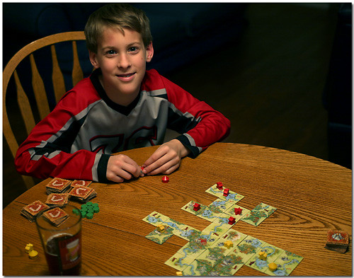 Matthew Playing Carcassonne