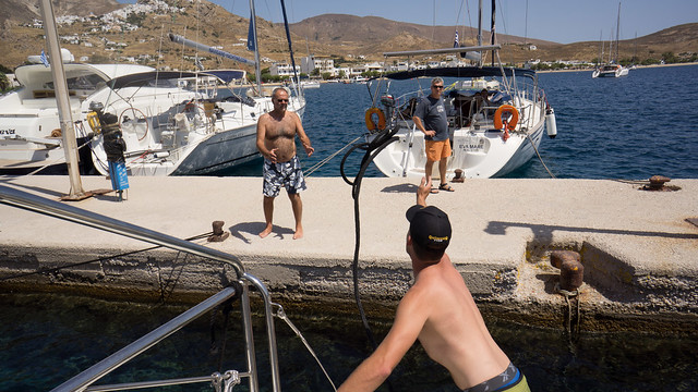 Andrew throwing a line for our first Med mooring - Livadi Harbour on Serifos