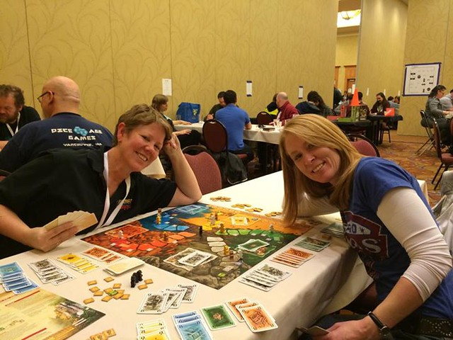 Lost Cities board game with two beautiful ladies