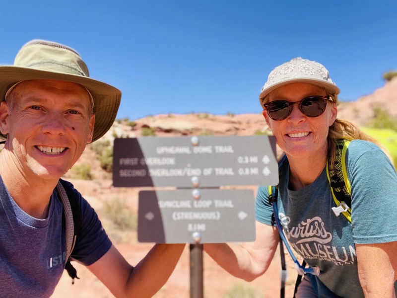 chris-and-julie-with-a-trail-sign.jpeg