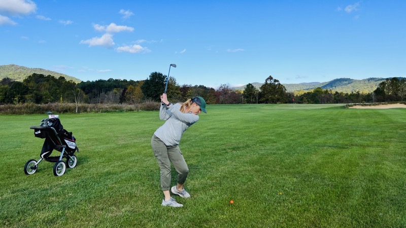 Julie hitting an approach shot