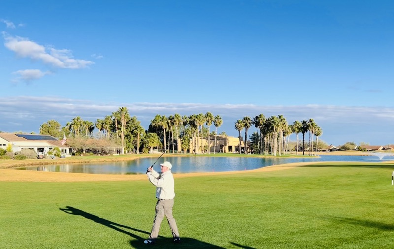 John hitting off fairway