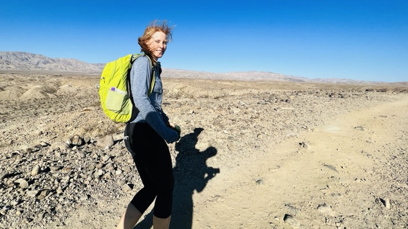 Julie hiking in the wind