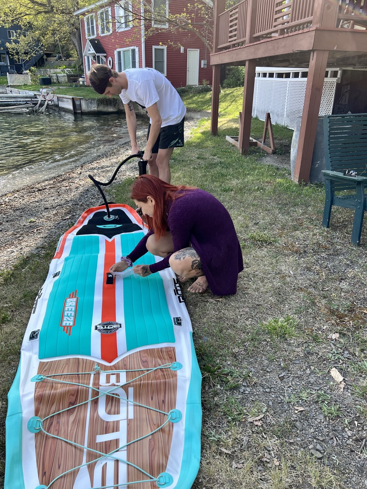 Inflating Julie's paddle board