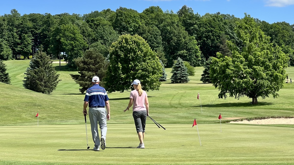 Julie with her golf coach