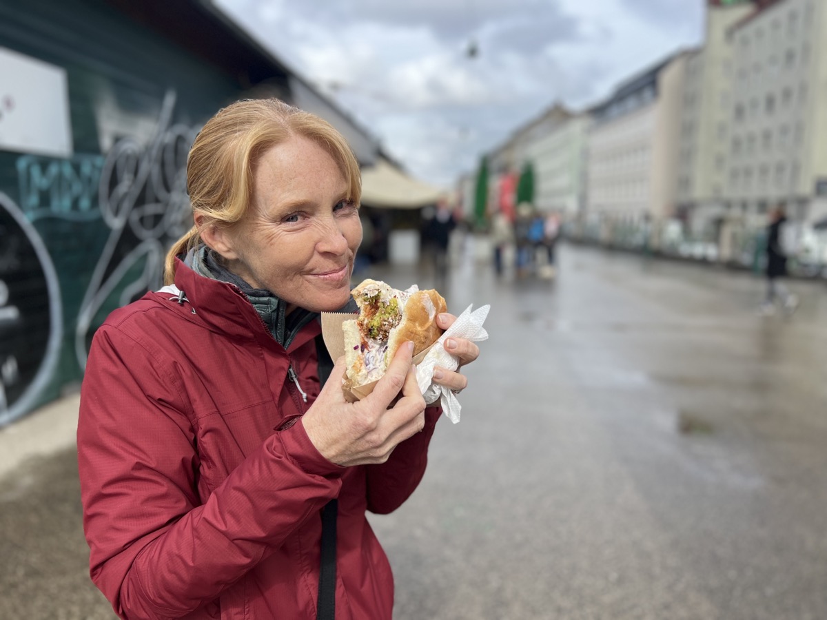 Julie enjoys a falafel sandwich