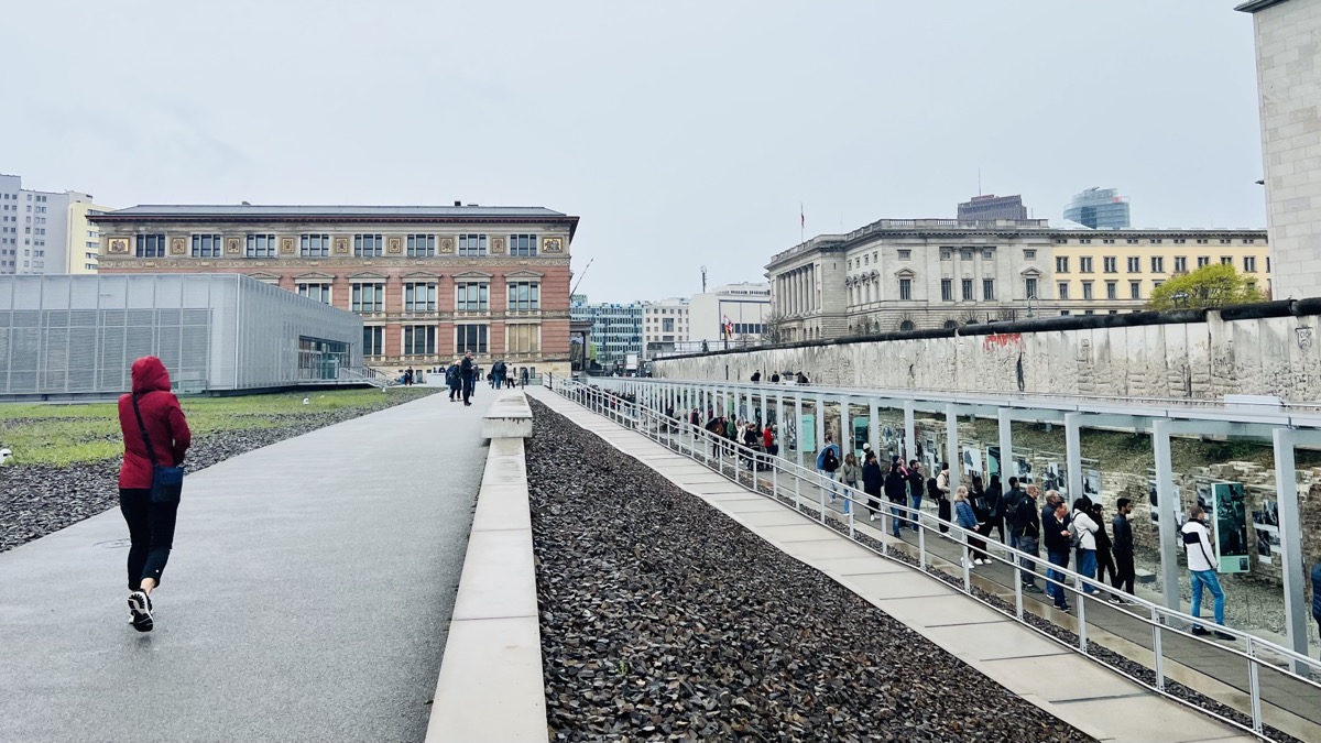 Julie strolling in rain by Topography of Terror