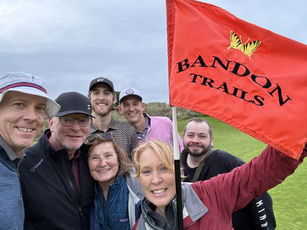 Our crew celebrating Bandon Trails on the 18th green