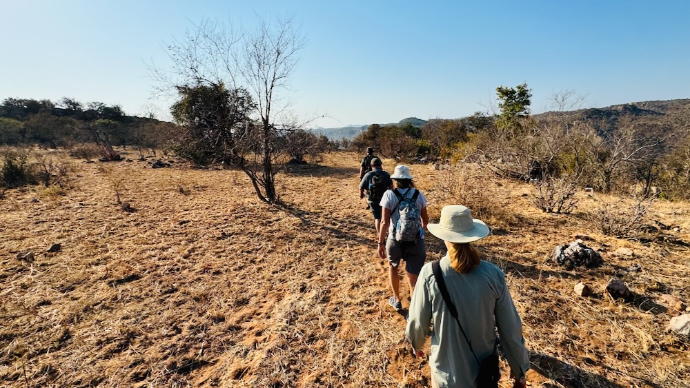 Single file hiking, following our two rifles