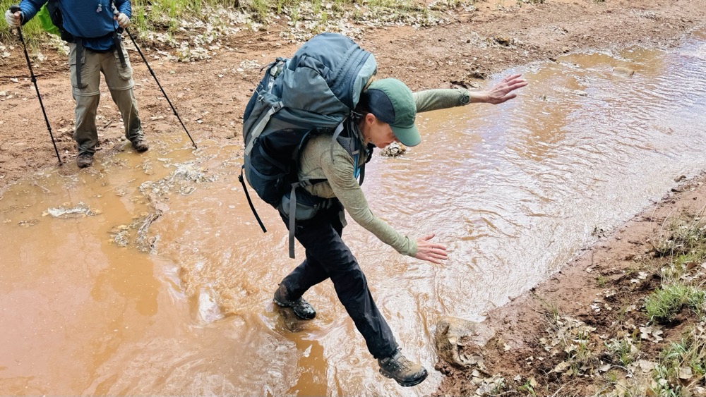 Julie crossing the stream